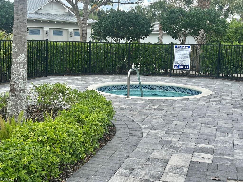 9179 Cayman Drive Naples, FL 34114 - Photo 37 of 50 a front view of a house with a yard