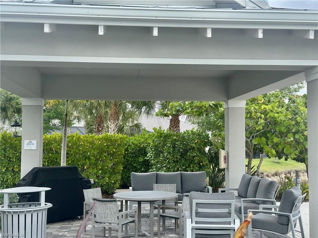 9179 Cayman Drive Naples, FL 34114 - Photo 41 of 50 a view of balcony with couch and chairs