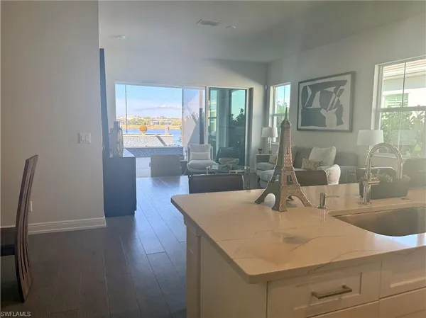 a room with wooden floor and glass door
