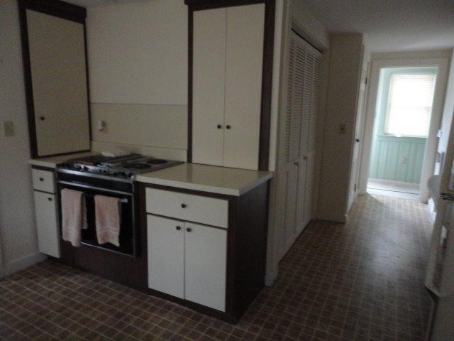 9 Kelley Road Hyannis, MA 02601 - Photo 11 of 18 a kitchen with a stove and a wooden floor