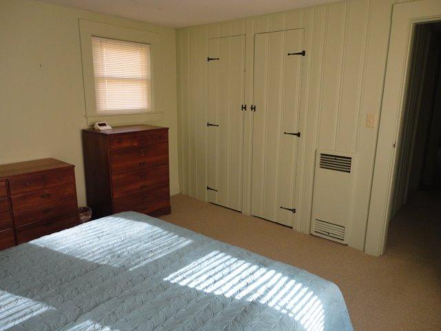 9 Kelley Road Hyannis, MA 02601 - Photo 14 of 18 a bedroom with a bed and a mirror