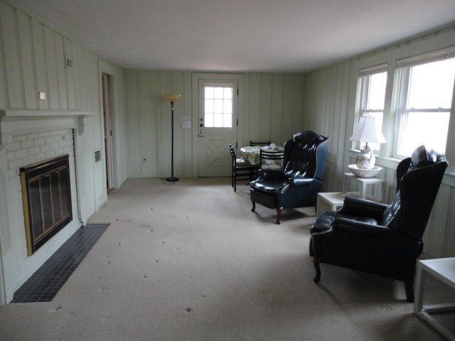9 Kelley Road Hyannis, MA 02601 - Photo 4 of 18 a living room with furniture and a fireplace