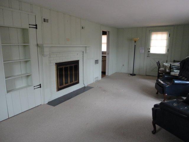 9 Kelley Road Hyannis, MA 02601 - Photo 5 of 18 a view of a livingroom with furniture and a fireplace
