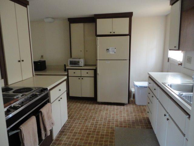 9 Kelley Road Hyannis, MA 02601 - Photo 8 of 18 a kitchen with a sink stove and cabinets
