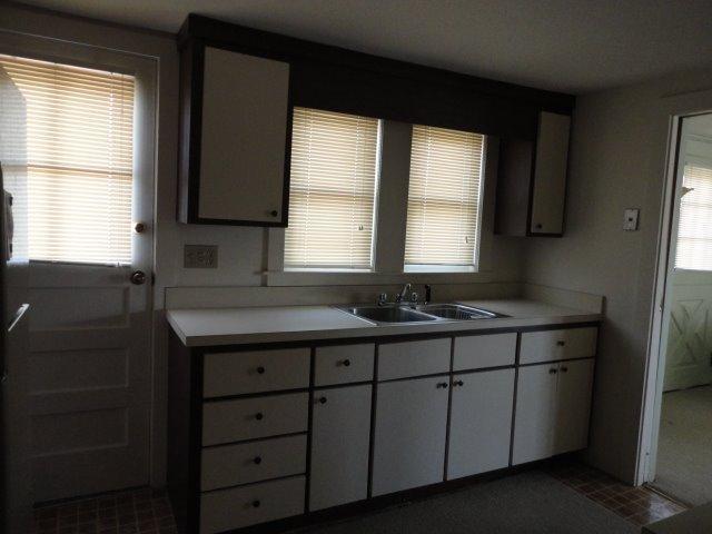 9 Kelley Road Hyannis, MA 02601 - Photo 9 of 18 a kitchen with a sink a window and cabinets