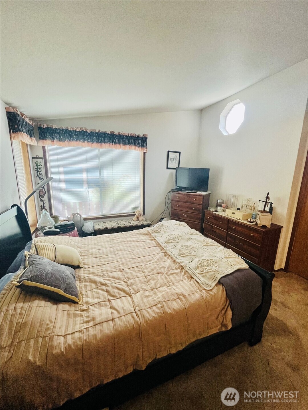 840 Northeast Karol Loop Walla Walla, WA 99362 - Photo 5 of 17 a bedroom with a bed and wooden floor