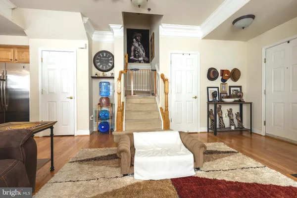 a living room with furniture and a clock