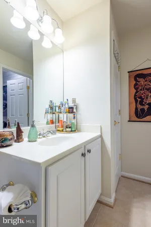 a room with a sink cabinets and a couch