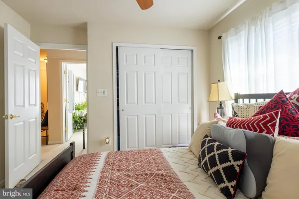 a bedroom with furniture and a window