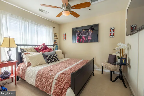 a bedroom with bed and a window