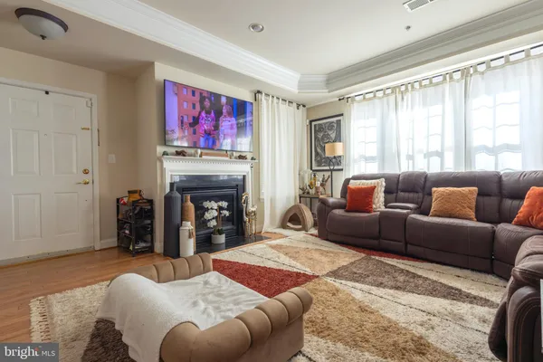 a bedroom with furniture and a fireplace