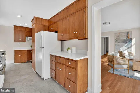 a kitchen with stainless steel appliances a refrigerator and a stove