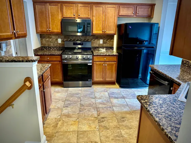 a kitchen with a stove and a microwave