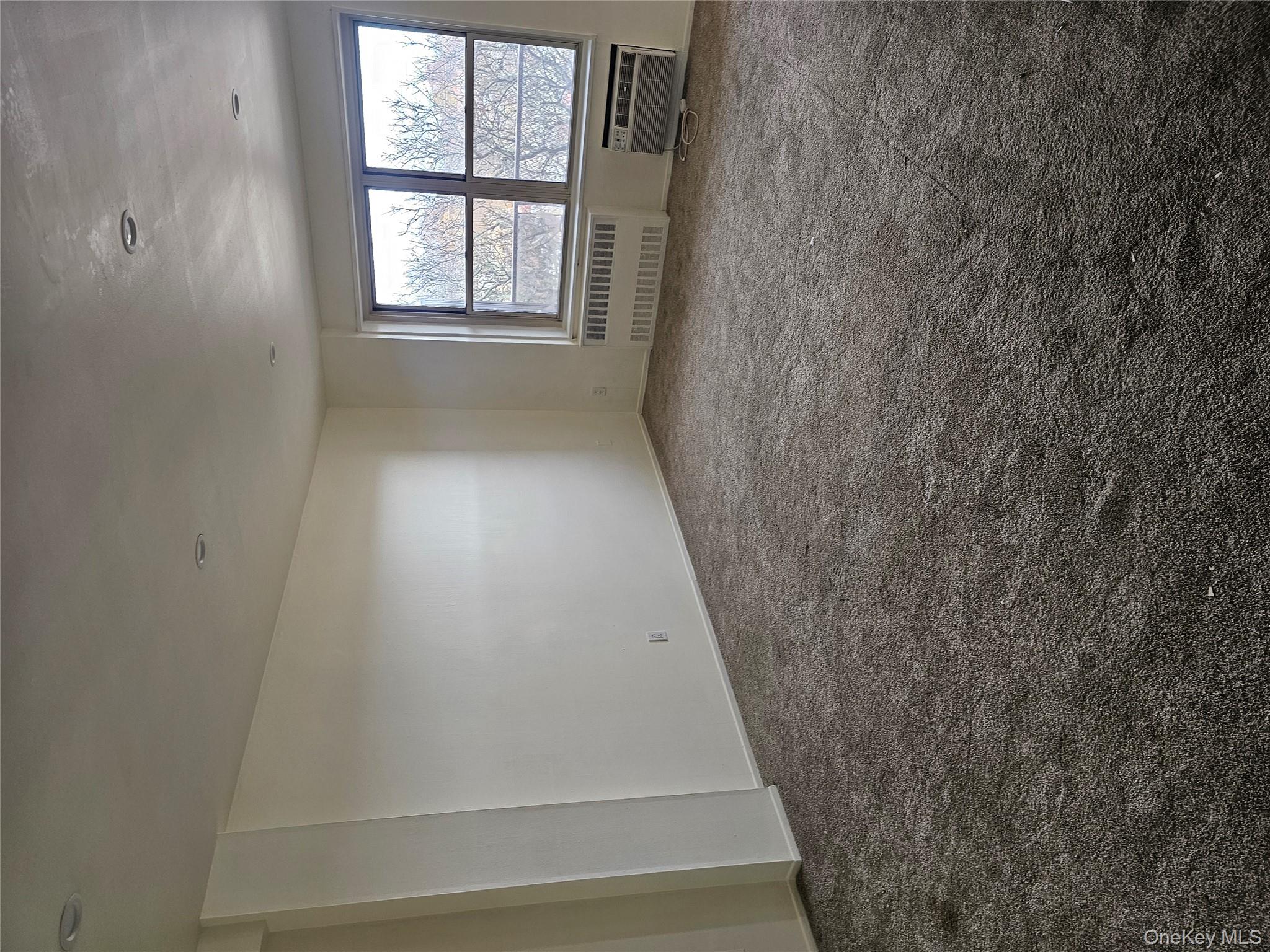 20 Wendell Street Hempstead, NY 11550 - Photo 3 of 6 an empty room with windows