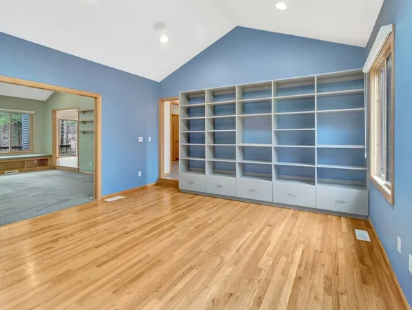 a large kitchen with stainless steel appliances granite countertop a refrigerator and a sink