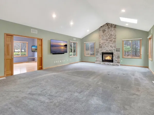 a kitchen with stainless steel appliances granite countertop white cabinets granite counter tops and a window