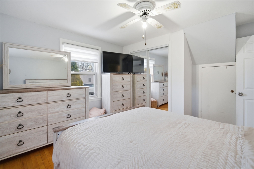 26 Cuff Avenue Springfield, MA 01104 - Photo 11 of 26 a bedroom with a large bed and a flat screen tv