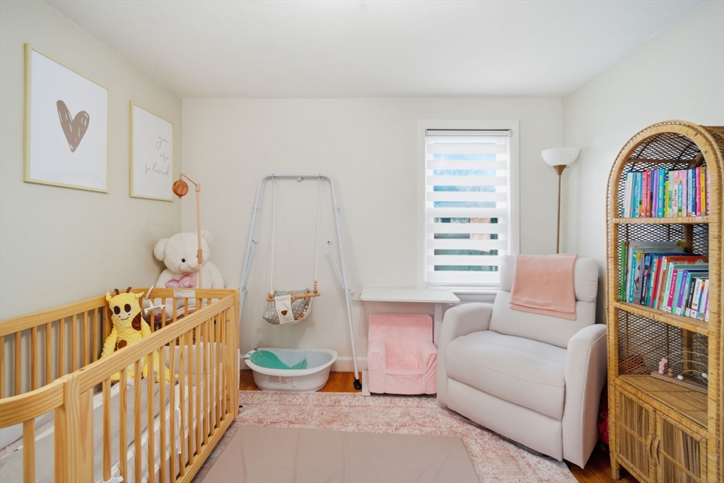 26 Cuff Avenue Springfield, MA 01104 - Photo 13 of 26 a bedroom with furniture and a book shelf