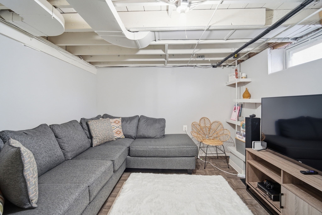 26 Cuff Avenue Springfield, MA 01104 - Photo 20 of 26 a living room with furniture and a flat screen tv