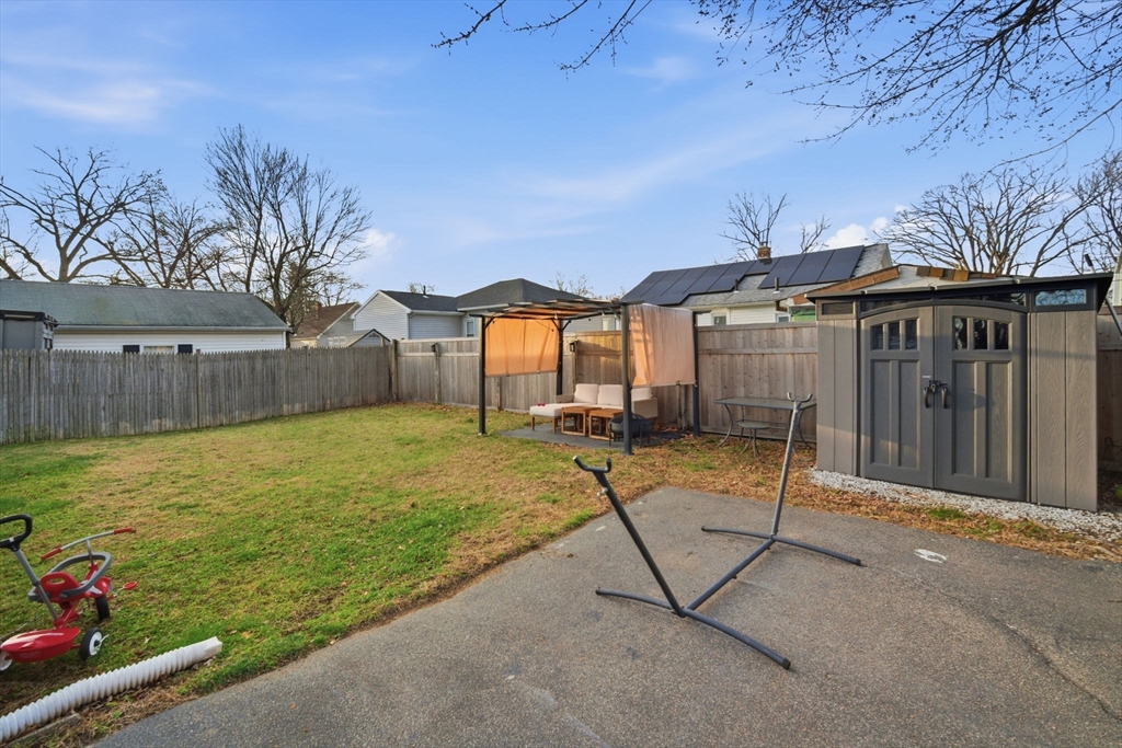 26 Cuff Avenue Springfield, MA 01104 - Photo 24 of 26 a view of a house with backyard and sitting area