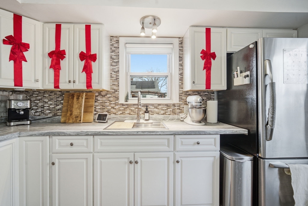 26 Cuff Avenue Springfield, MA 01104 - Photo 6 of 26 a bathroom with a sink vanity and a mirror