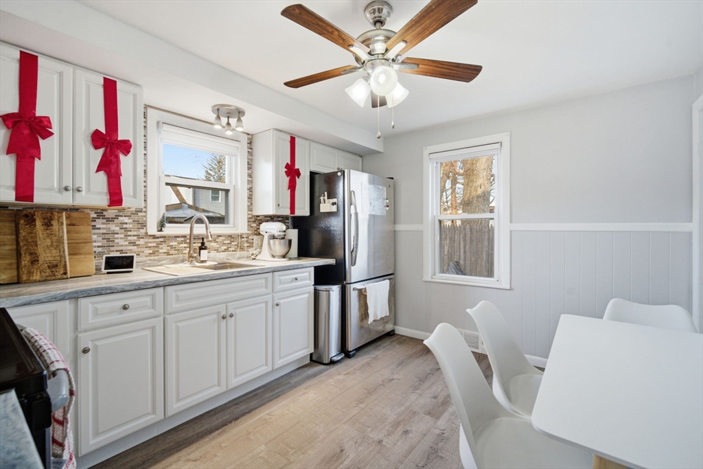 26 Cuff Avenue Springfield, MA 01104 - Photo 9 of 26 a kitchen with granite countertop a sink appliances cabinets and furniture