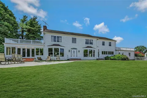 a front view of a house with garden and porch