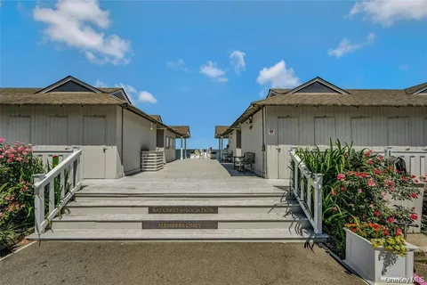 a view of a house with wooden fence