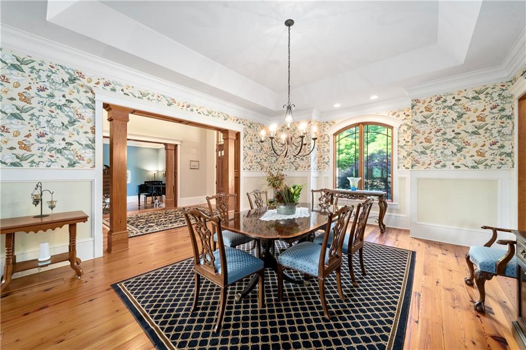 1447 Travis Smith Road Clarkesville, GA 30523 - Photo 21 of 73 a view of a dining room with furniture wooden floor and chandelier