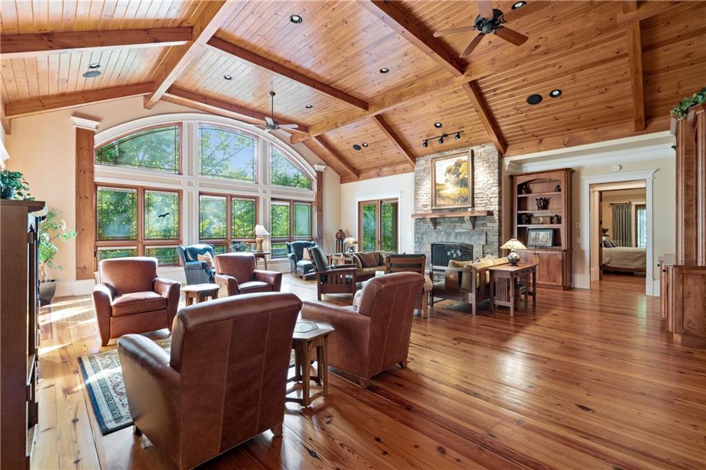 1447 Travis Smith Road Clarkesville, GA 30523 - Photo 22 of 73 a living room with furniture a wooden floor and next to a window