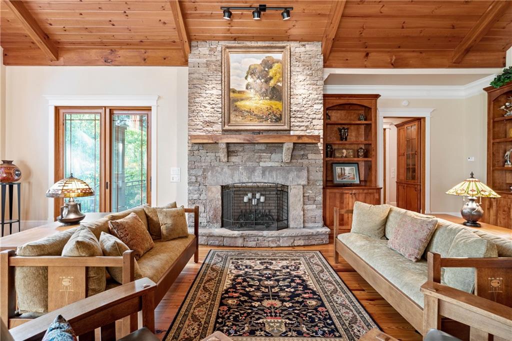 1447 Travis Smith Road Clarkesville, GA 30523 - Photo 23 of 73 a living room with furniture and a fireplace