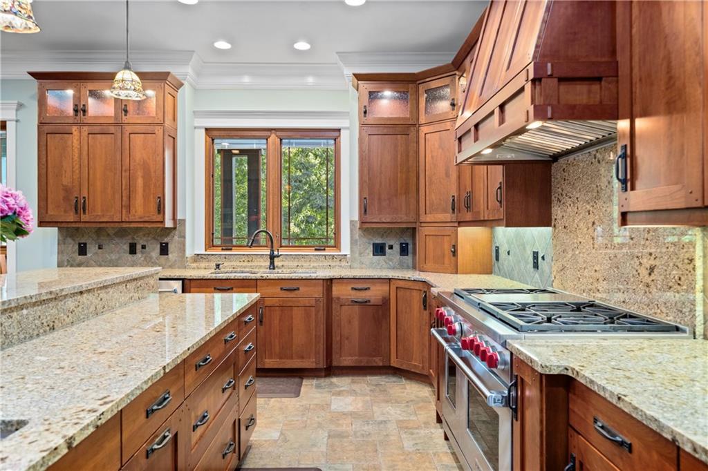 1447 Travis Smith Road Clarkesville, GA 30523 - Photo 27 of 73 a kitchen with a sink stove and cabinets
