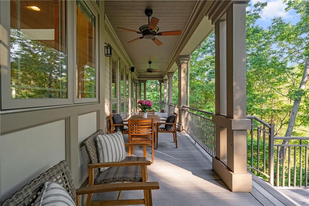 1447 Travis Smith Road Clarkesville, GA 30523 - Photo 31 of 73 a view of a porch with chairs and backyard