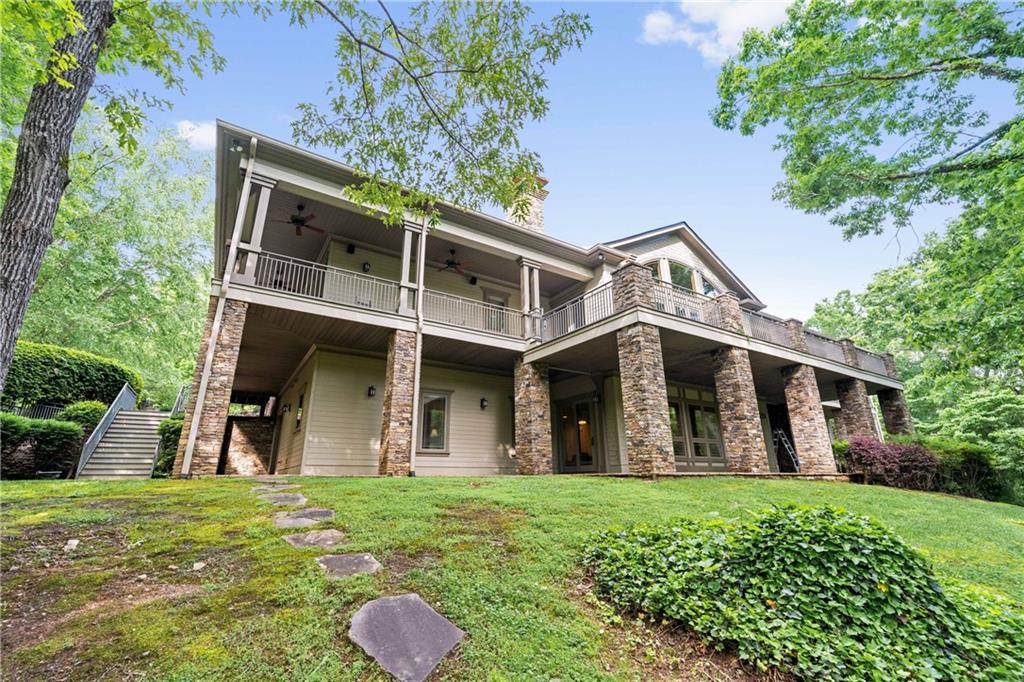 1447 Travis Smith Road Clarkesville, GA 30523 - Photo 35 of 73 a front view of a house with garden
