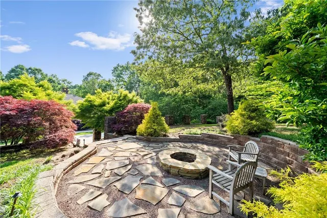 a bathroom with a granite countertop sink vanity and mirror