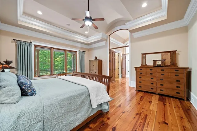 a bed room with a bed and a chandelier