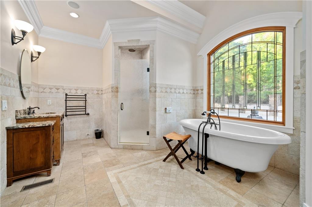 1447 Travis Smith Road Clarkesville, GA 30523 - Photo 41 of 73 a spacious bathroom with a tub shower and a sink