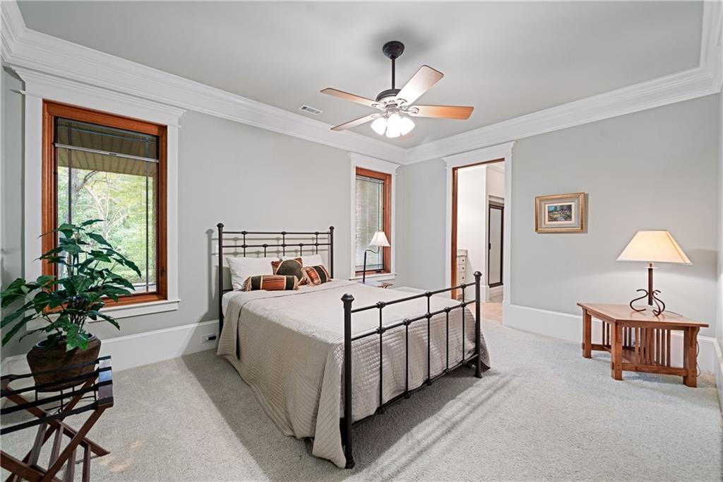 1447 Travis Smith Road Clarkesville, GA 30523 - Photo 53 of 73 a bed room with a bed and a chandelier