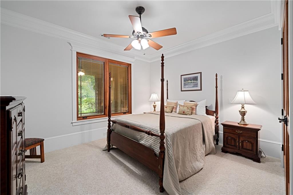 1447 Travis Smith Road Clarkesville, GA 30523 - Photo 55 of 73 a bed room with a bed and a chandelier