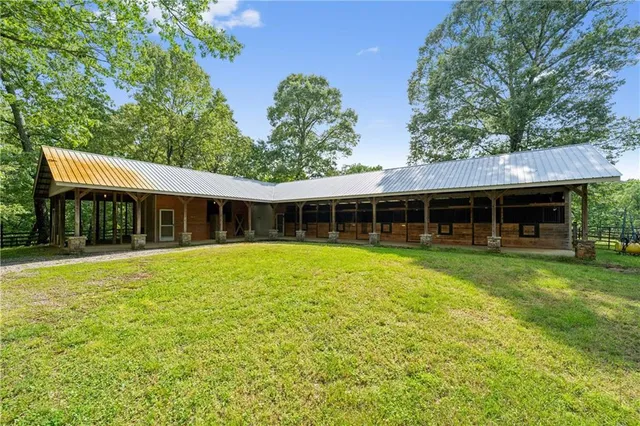 a view of a garden with a building in the background