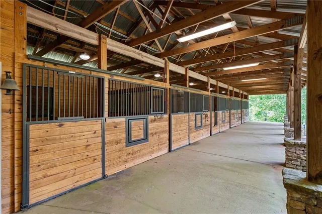 a view of a house with a swimming pool and a yard