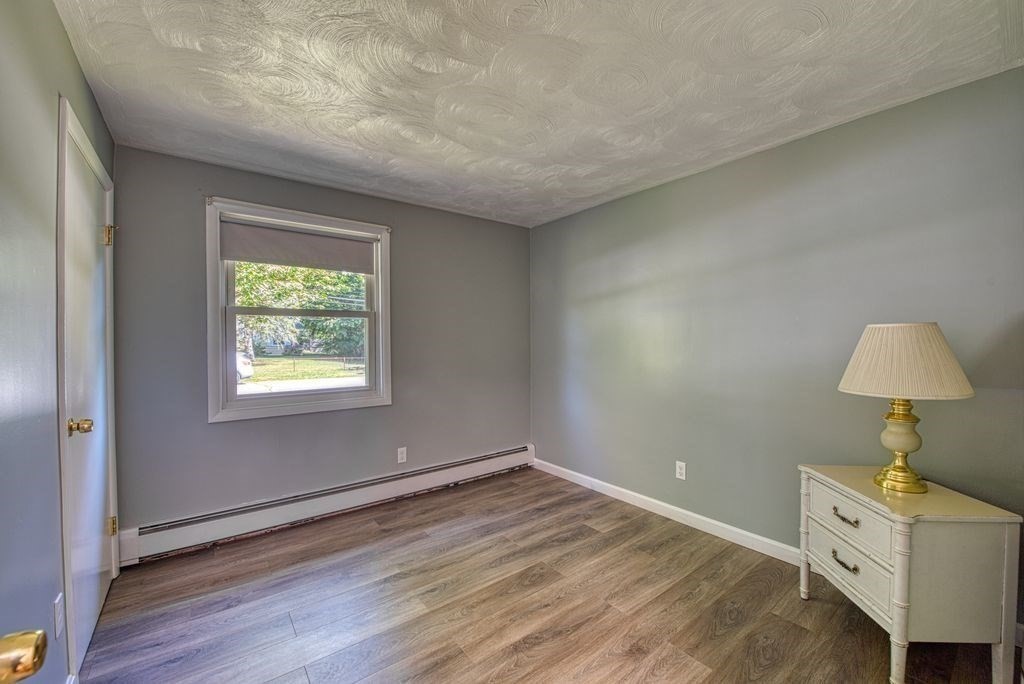 81 Errol Road Brockton, MA 02302 - Photo 9 of 31 an empty room with a window and a table