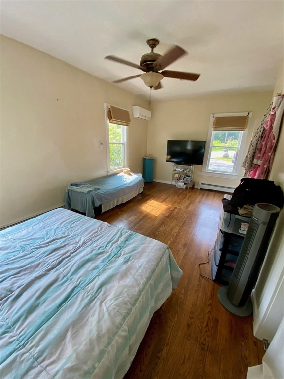 7 North Sturbridge Road Charlton, MA 01507 - Photo 13 of 42 a bedroom with a bed and a flat tv screen on the dresser