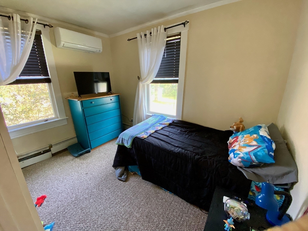 7 North Sturbridge Road Charlton, MA 01507 - Photo 17 of 42 a bedroom with a bed and a window