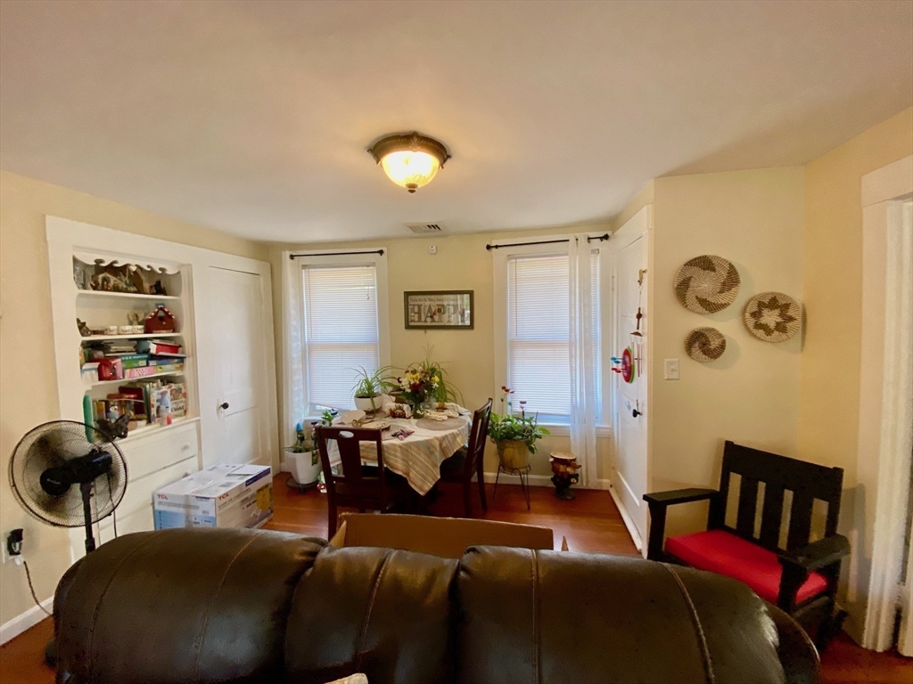 7 North Sturbridge Road Charlton, MA 01507 - Photo 28 of 42 a living room with furniture and a book shelf