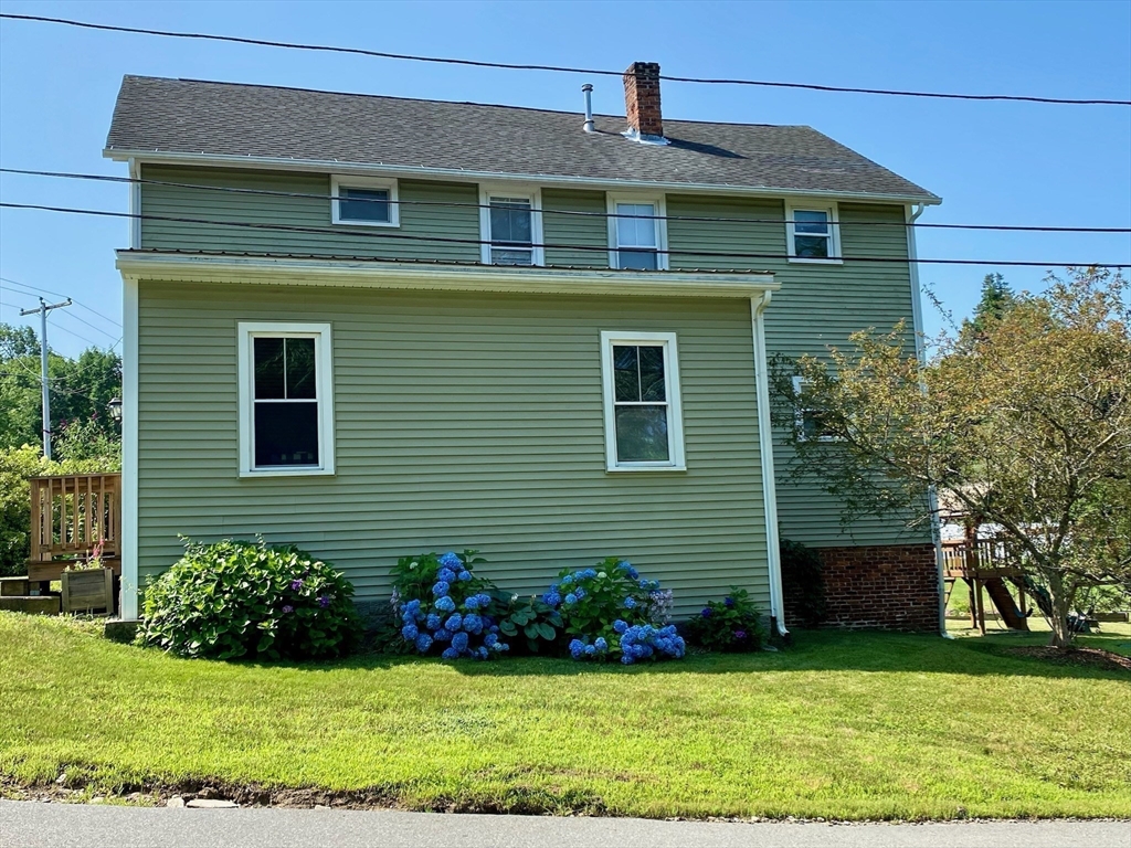 7 North Sturbridge Road Charlton, MA 01507 - Photo 3 of 42 a front view of a house with a yard