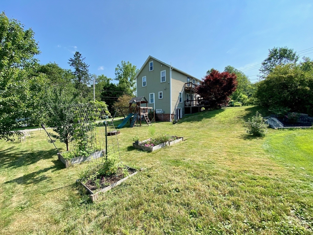 7 North Sturbridge Road Charlton, MA 01507 - Photo 40 of 42 a view of a house with a yard