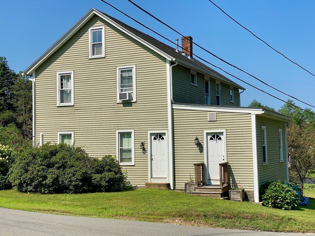 7 North Sturbridge Road Charlton, MA 01507 - Photo 4 of 42 a front view of a house with a yard