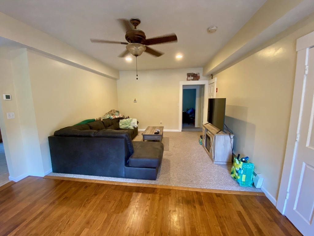 7 North Sturbridge Road Charlton, MA 01507 - Photo 8 of 42 a living room with furniture and a flat screen tv