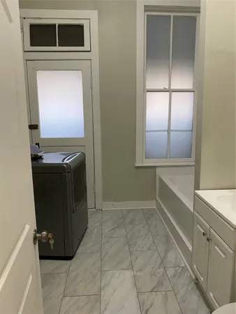 a kitchen with a refrigerator and a stove
